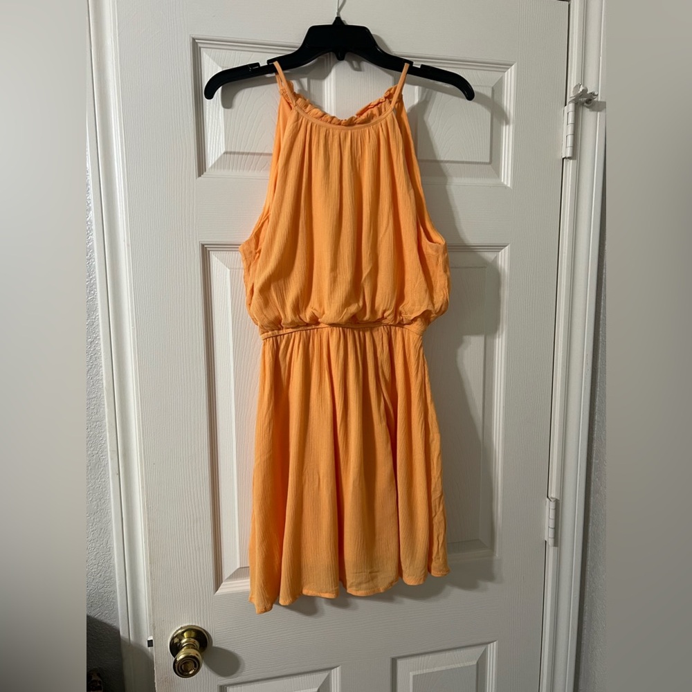The cutest dress, perfect for summer and the color is stunning! New with tags 🧡